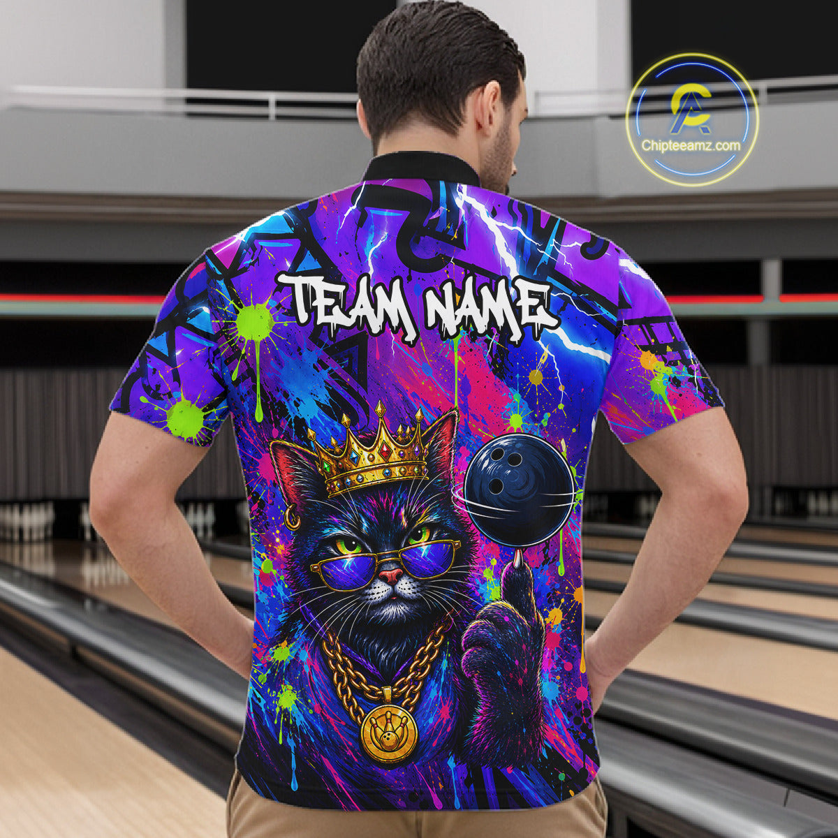 Men wearing personalized bowling quarter zip shirt with a crowned cat holding a bowling ball, blended with colorful paint strokes and graphic patterns.