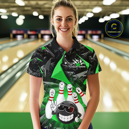 A woman standing in a bowling alley wearing a custom short-sleeve bowling polo shirt with a black and green leaf pattern and a cartoon bowling graphic. The shirt has a black collar and sleeve cuffs, with 'YOUR NAME' printed on the chest.