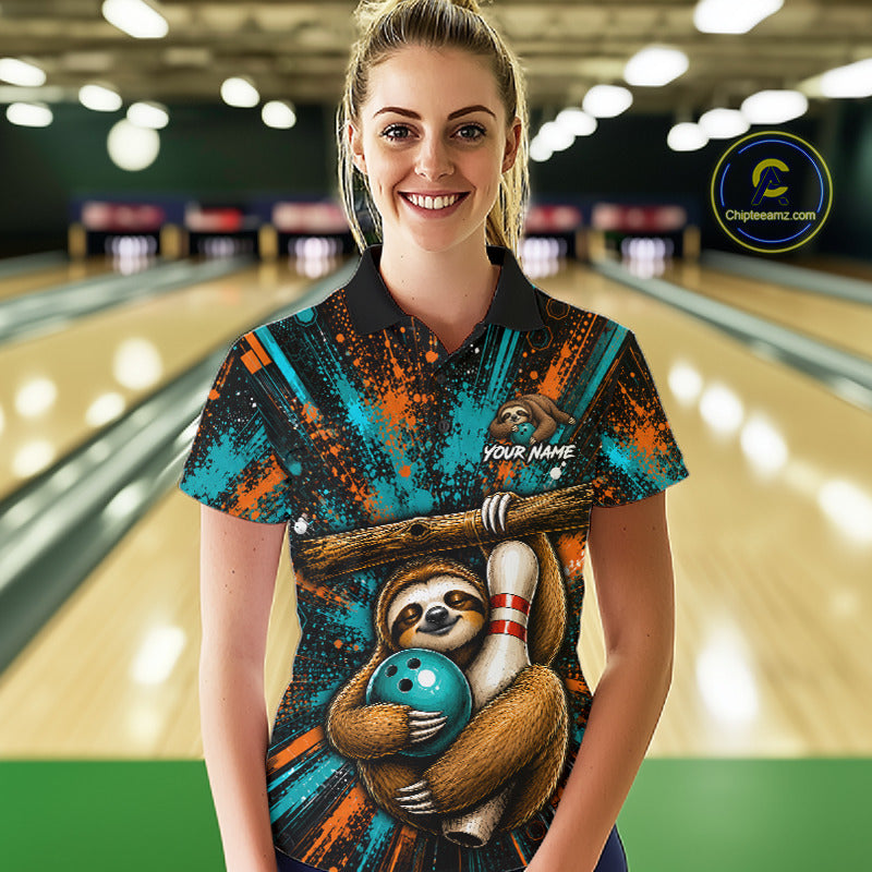 A woman standing in a bowling alley wearing a custom short-sleeve polo shirt with a sloth and bowling ball graphic, teal and orange paint splatter patterns, and a black collar. A circular 'ChileanSeam' watermark is visible in the top right corner.
