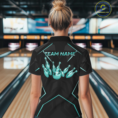Person wearing a black bowling shirt with teal graphics and 'TEAM NAME' text in a bowling alley.