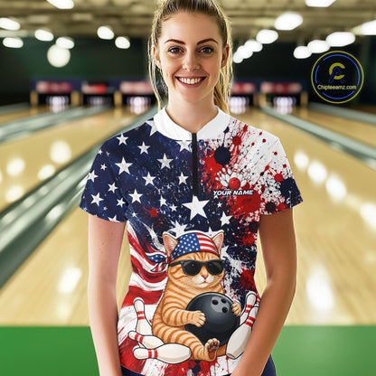 Woman wearing a colorful bowling shirt with a cat design in a bowling alley.