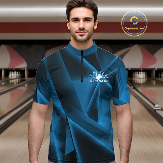 Man wearing a blue bowling shirt with a personalized design in a bowling alley.