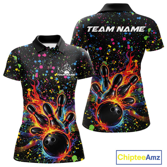 Front and back views of a black womens bowling polo shirt showcasing a flaming bowling ball striking pins with colorful paint splatter graphics.