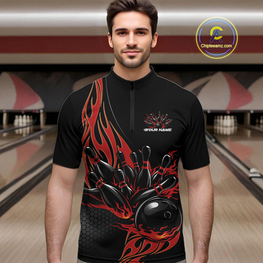 Male model front view in bowling lane wearing black quarter zip shirt with red flaming bowling ball hitting pins in intense action sports artwork.