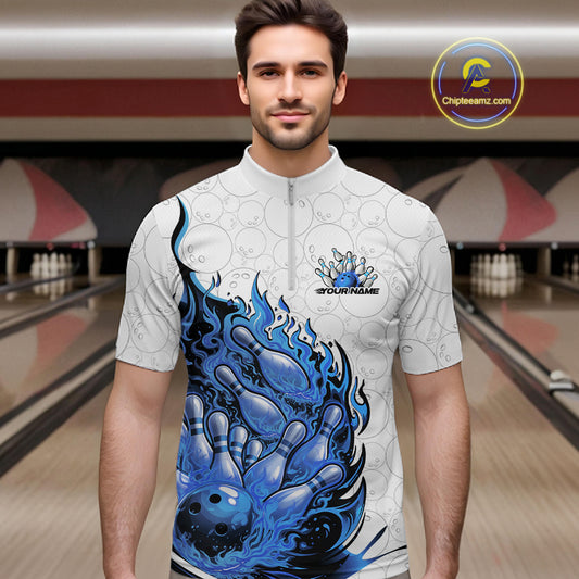 Male model in bowling lane wearing quarter-zip shirt with flaming bowling ball crashing pins white blue purple sports artwork