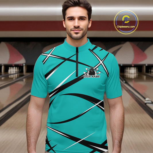Front view of a male bowler wearing a turquoise blue, black, and white bowling quarter-zip shirt in a bowling lane