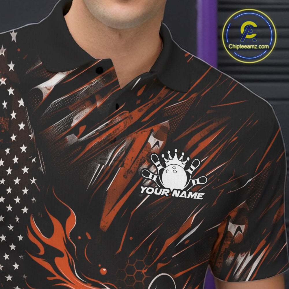 Close-up left chest view of a black and orange bowling polo shirt featuring a flaming bowling ball and patriotic pin artwork.