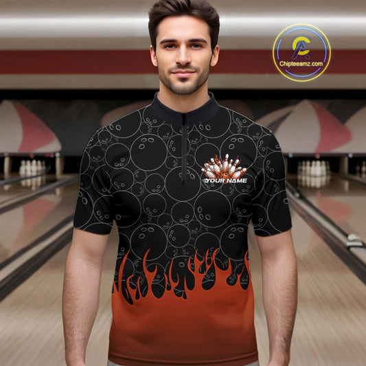 Male model in a bowling lane wearing black quarter zip shirt, front view featuring orange flames rising with bowling ball pattern and energetic sports design