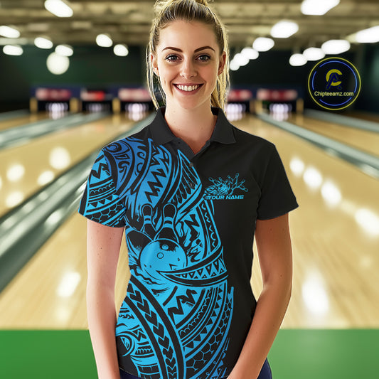 Female model wearing a black and blue bowling polo shirt at the bowling lane with Polynesian-inspired bowling motifs.