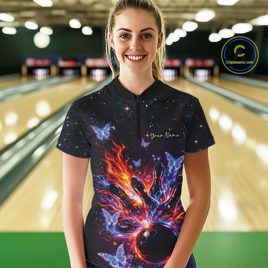 Female model wearing a black bowling quarter-zip shirt at the lane with cosmic bowling strike graphics.