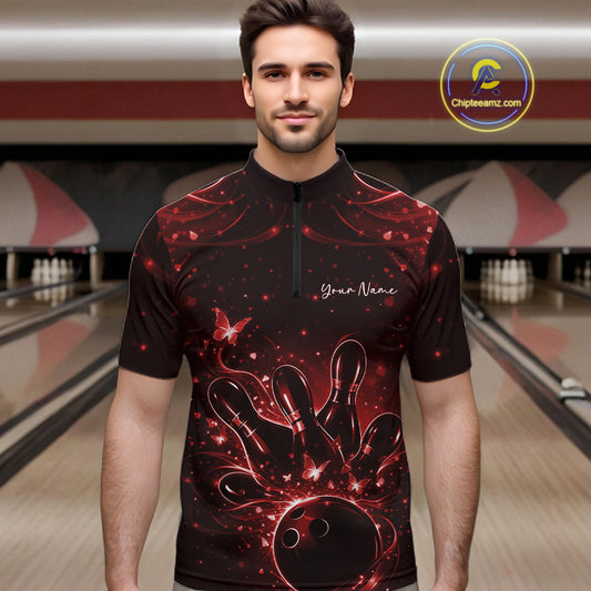 Male model wearing a black and red bowling quarter-zip shirt at the lane with glowing butterfly bowling motifs.