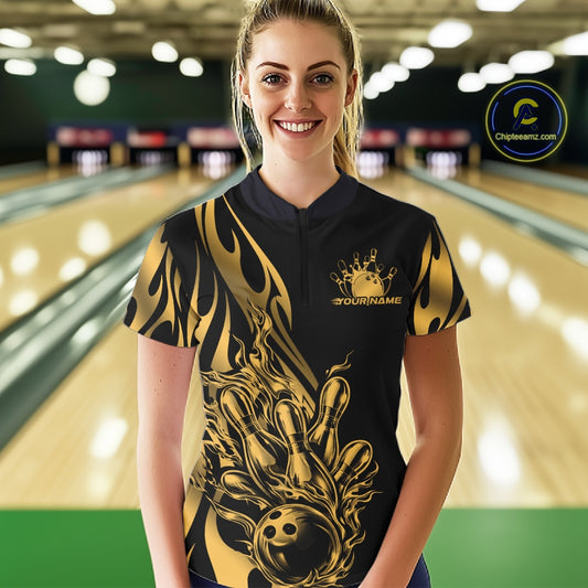 Female model front view in bowling lane wearing black quarter zip shirt with golden metal tribal flame bowling ball hitting pins illustration