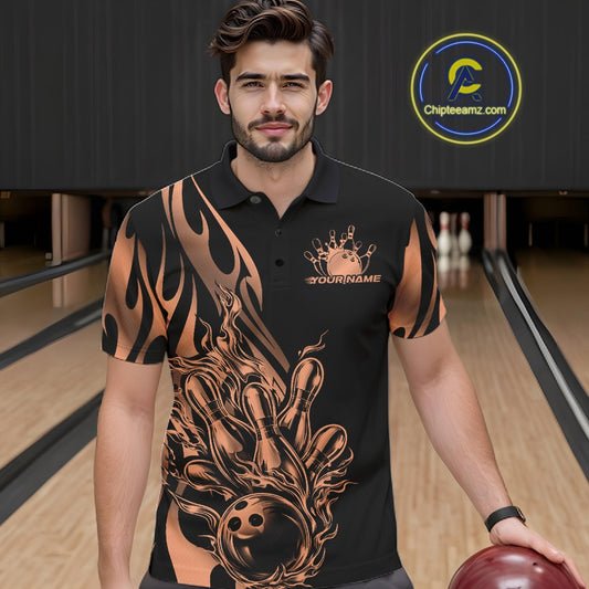 Male model seen from the front in a bowling lane wearing a black polo shirt featuring a rose gold gradient tribal flame bowling ball striking pins in a dynamic sports scene.