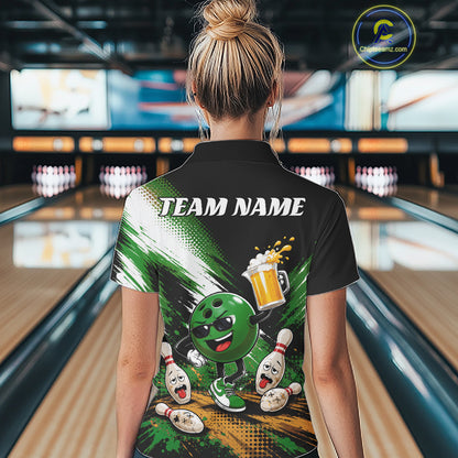 A woman viewed from behind wearing a black short-sleeve bowling-themed quarter zip shirt with a large green and white graphic print featuring a bowling ball character, pins, and the text 'TEAM NAME'. 