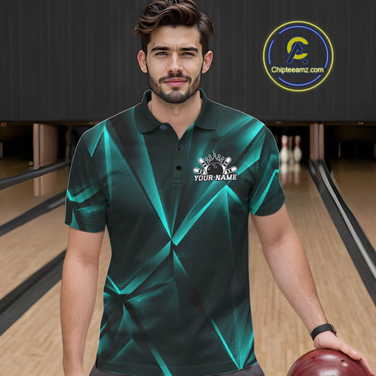 Man wearing a green and black patterned polo shirt with a logo on a bowling alley.