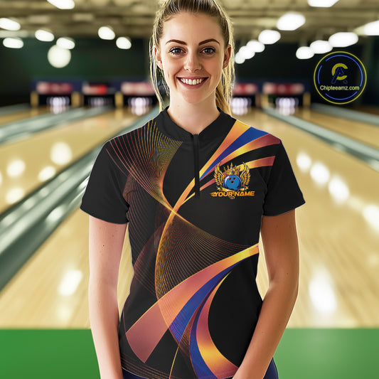 Woman wearing a colorful bowling shirt with a logo in a bowling alley.