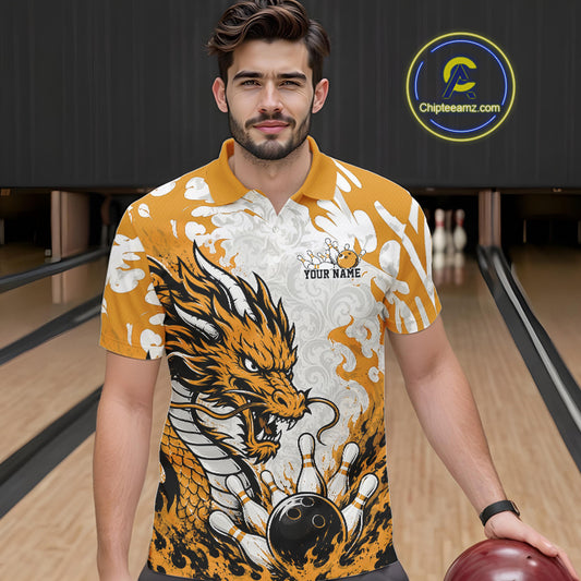 Man wearing a bowling shirt with a dragon design in a bowling alley, holding a bowling ball.