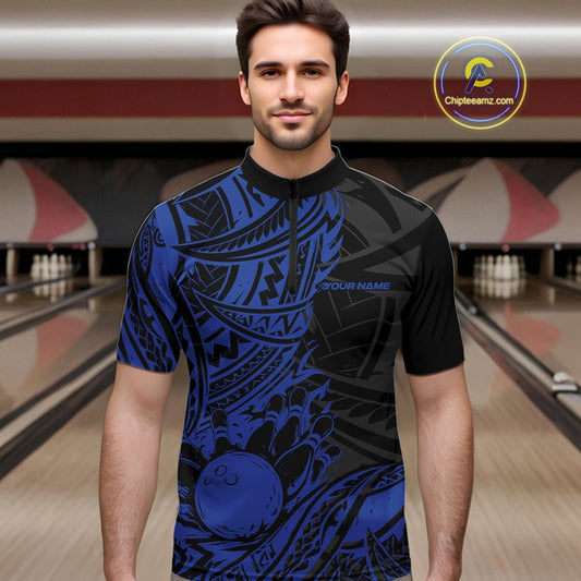 Man wearing a black and blue bowling shirt with a bowling alley in the background