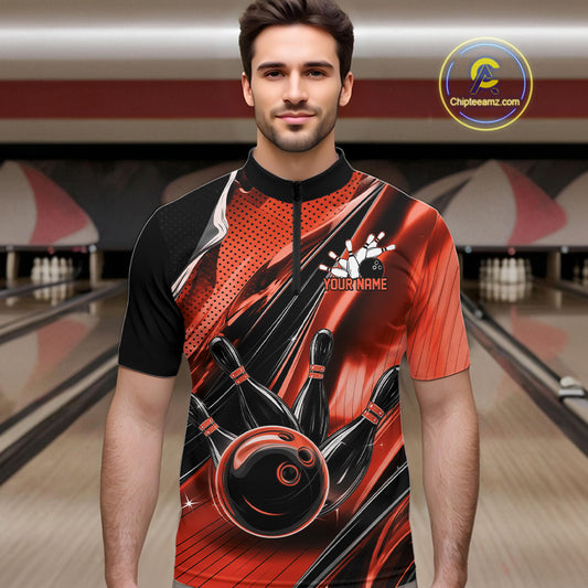 Male model wearing a black and orange bowling quarter-zip shirt at the lane with energetic bowling ball and pin graphics.
