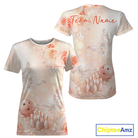 Front and back view of a women’s crewneck bowling T-shirt with pastel glitter butterflies floating above bowling pins and a bowling ball.