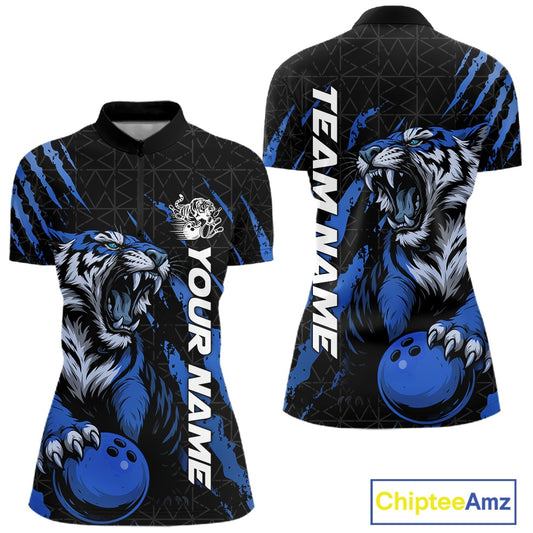 Front and back view of a black and mid blue women's bowling quarter-zip shirt showcasing a roaring tiger holding a mid blue bowling ball with matching claw-stripe artwork and a geometric background pattern.
