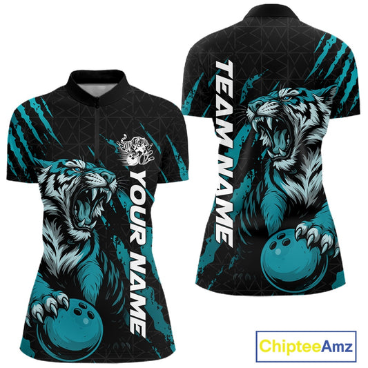 Front and back view of a black and teal blue women's bowling quarter-zip shirt displaying a roaring tiger holding a teal blue bowling ball with matching claw-stripe graphics and a geometric background pattern.