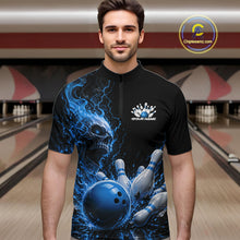 Load image into Gallery viewer, Front view of a male model in a bowling alley wearing a black bowling quarter zip shirt featuring a blue fiery skull design with lightning striking a bowling ball and pins and a custom name.