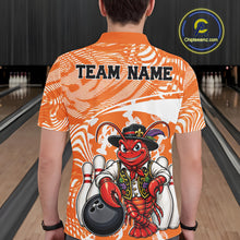 Load image into Gallery viewer, Back view of a male model in a bowling alley wearing an orange custom bowling polo shirt with a funny Cajun crawfish leaning on a bowling ball and a swamp inspired texture background.