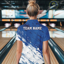 Load image into Gallery viewer, Back view of a female bowler in a bowling alley wearing a white and blue bowling polo shirt with a splatter-inspired sports jersey design