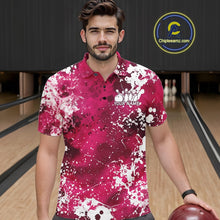 Load image into Gallery viewer, Front view of a female model in a bowling alley wearing a bowling polo shirt featuring a white paint splatter design on an orange shirt.
