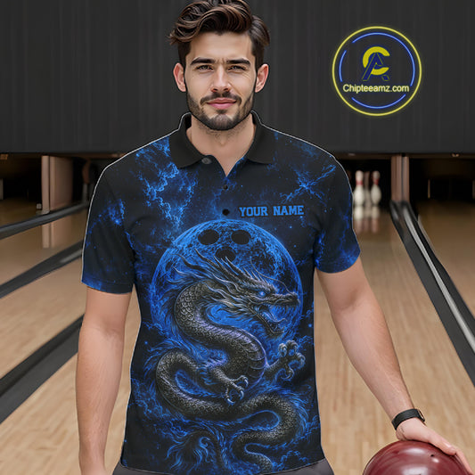 Front view of a male model in a bowling alley wearing a blue custom bowling polo shirt featuring an ancient dragon, flames, and a moon-inspired bowling ball design.