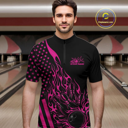 Male model wearing a black bowling quarter-zip shirt at a bowling lane with pink flame bowling strike artwork and patriotic accents.