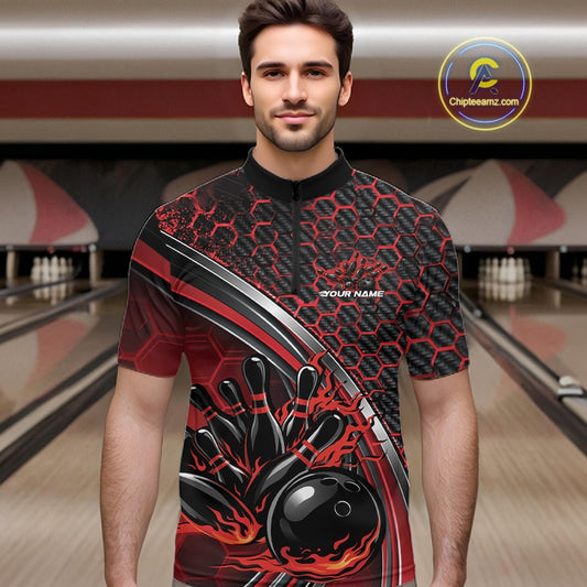 Male model in a bowling lane wearing a black and red quarter zip shirt with honeycomb design and a dynamic flame bowling strike graphic.