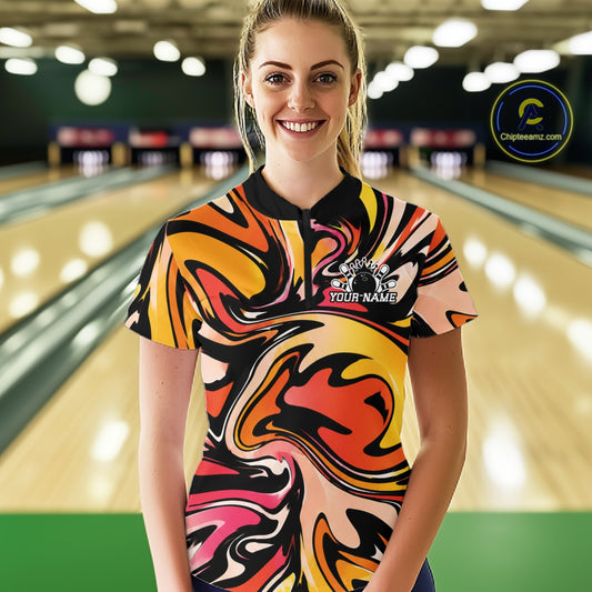 Woman wearing a colorful bowling shirt with a bowling alley in the background