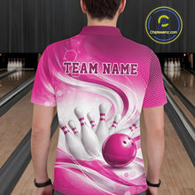 Load image into Gallery viewer, Back view of a male model wearing a white and pink bowling polo shirt in a bowling alley featuring flowing abstract wave patterns and a glossy bowling ball striking a set of pins