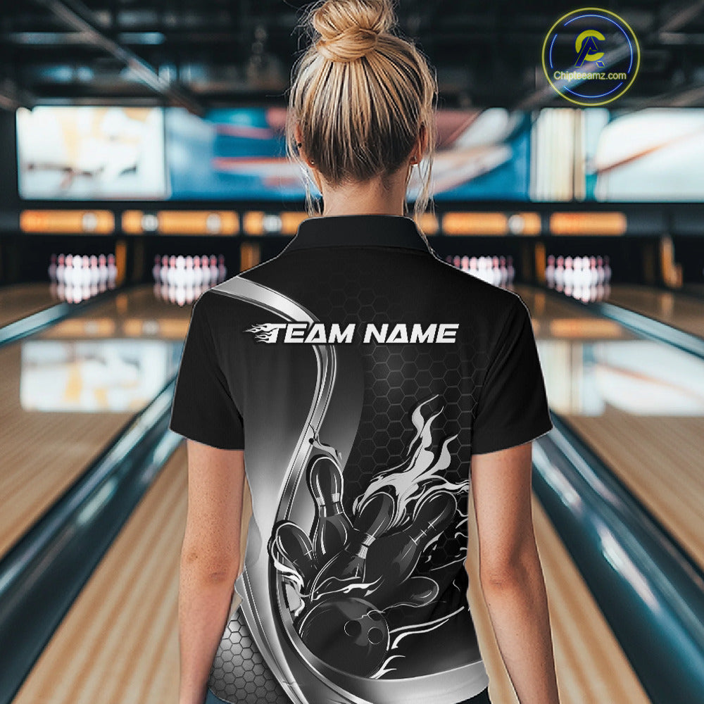 Female model back view inside bowling venue wearing black and gray quarter zip shirt with fiery bowling strike illustration