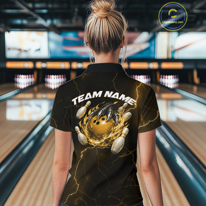 Back view of a black and yellow womens bowling polo displaying a dragon claw holding a flaming bowling ball with pin graphics.