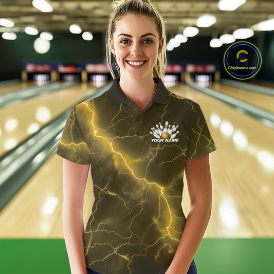 Female model at the bowling lane wearing a bowling polo with yellow cobra artwork and bowling-themed graphics.
