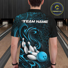 Load image into Gallery viewer, Back view of a male model wearing a black and blue bowling polo shirt in a bowling alley featuring a tribal flame bowling ball and pins graphic