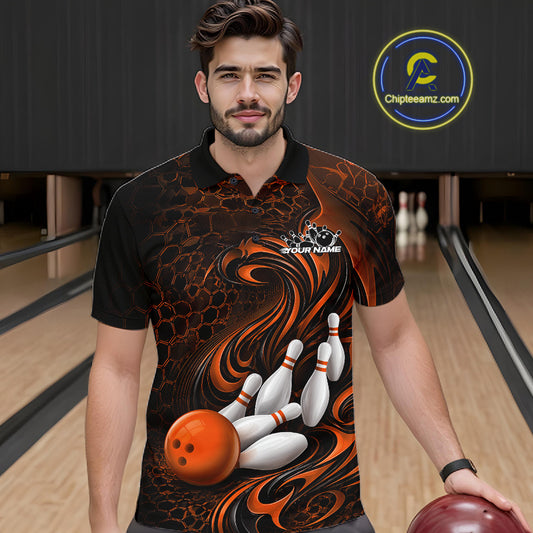Male model standing in a bowling lane wearing a black and orange bowling polo shirt featuring a tribal flame design with a bowling ball and pins on the front.