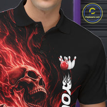 Load image into Gallery viewer, Close-up of the left chest on a black bowling polo shirt featuring a skull clutching a bowling ball engulfed in swirling red energy flames