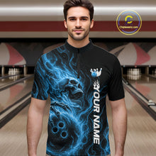 Load image into Gallery viewer, Male model wearing a black bowling quarter-zip shirt in a bowling alley featuring a skull clutching a bowling ball with swirling blue energy flames
