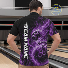 Load image into Gallery viewer, Male model wearing a black bowling quarter-zip shirt in a bowling alley featuring a skull clutching a bowling ball surrounded by swirling purple energy flames