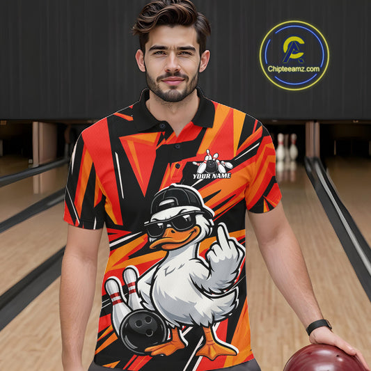 Male model wearing a black and orange bowling polo in a bowling center with duck-themed bowling artwork.