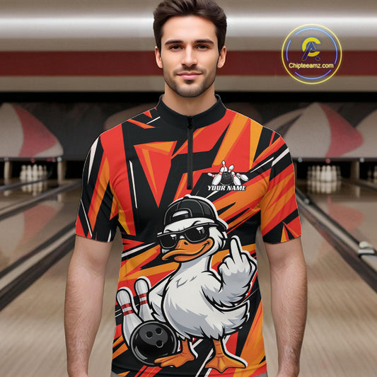 Male model wearing a black and orange quarter-zip in a bowling center with duck and bowling-themed illustrations.