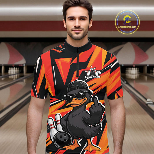 Male model wearing a black and orange bowling quarter-zip in a bowling lane with duck-themed bowling artwork and geometric background.