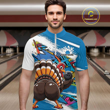 Load image into Gallery viewer, Front view of a male model wearing a blue custom quarter zip bowling shirt with a funny graffiti turkey holding a bowling ball, paint splatter accents in a bowling alley.
