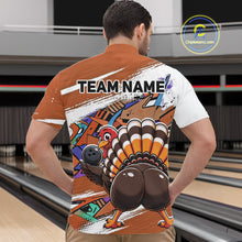 Load image into Gallery viewer, Back view of a male model wearing an orange custom quarter zip bowling shirt with a funny graffiti turkey holding a bowling ball, paint splatter accents in a bowling alley.