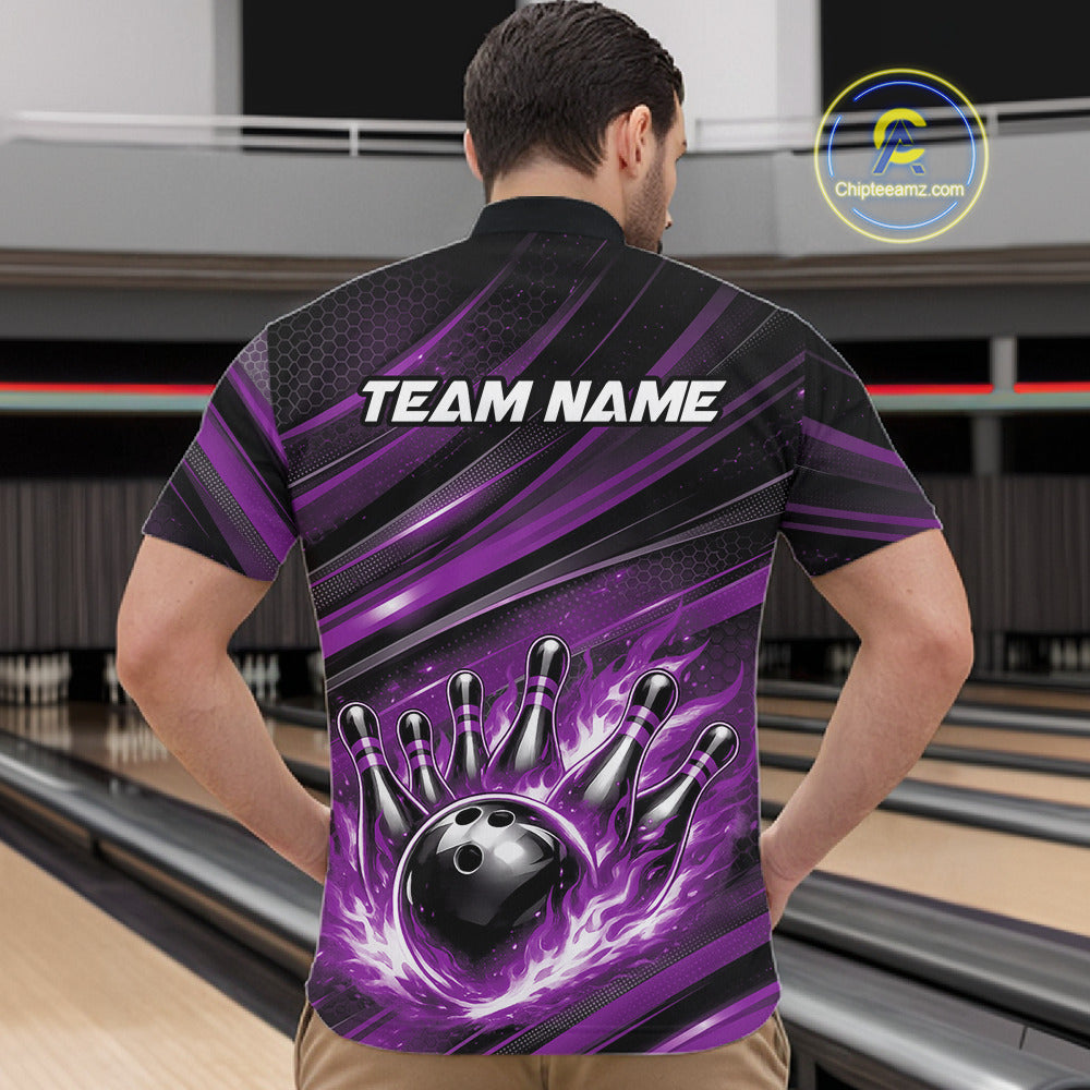 Front view of a male model in a bowling alley wearing a black and purple quarter-zip shirt featuring a bowling ball knocking down pins.