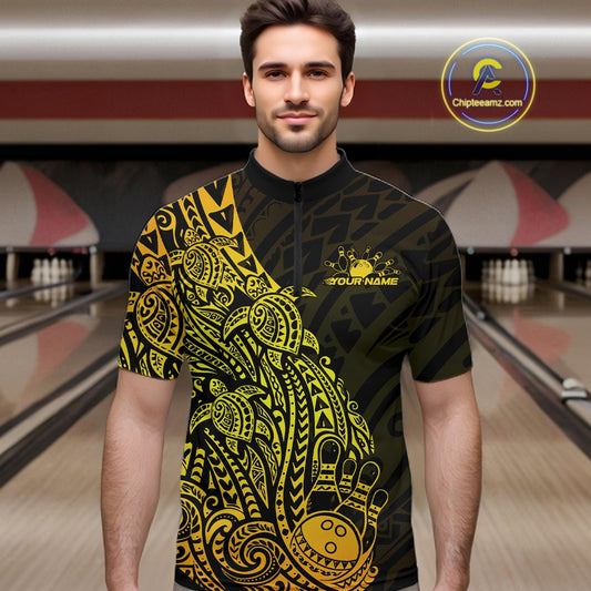 Male model wearing a black and gold bowling quarter-zip shirt at the lane with tribal bowling graphics and turtle motifs.